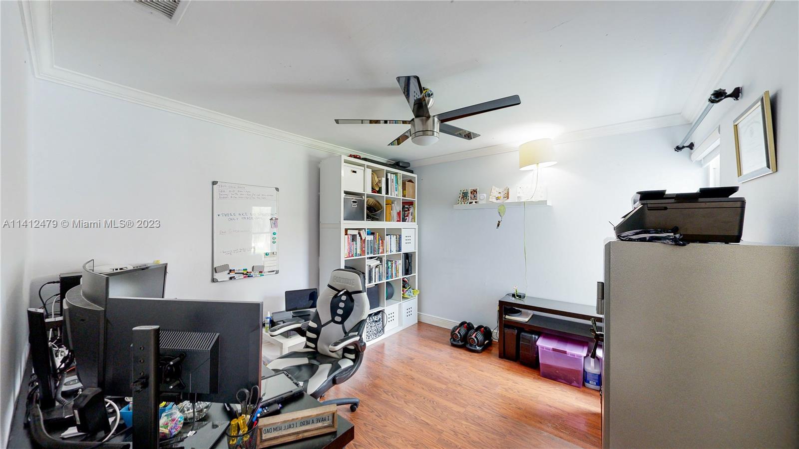 13821 Southwest 14th Street Miami, FL 33184 - Photo 27 of 58 a view of a workspace with furniture and a window