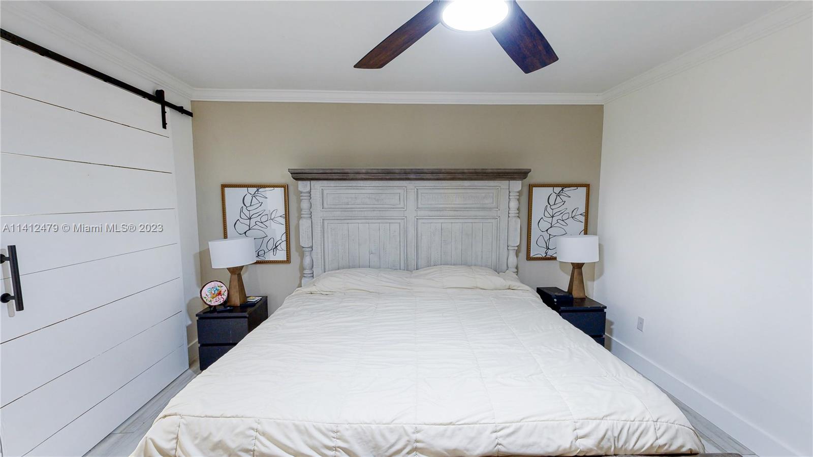 13821 Southwest 14th Street Miami, FL 33184 - Photo 32 of 58 a bedroom with a bed and a cabinets