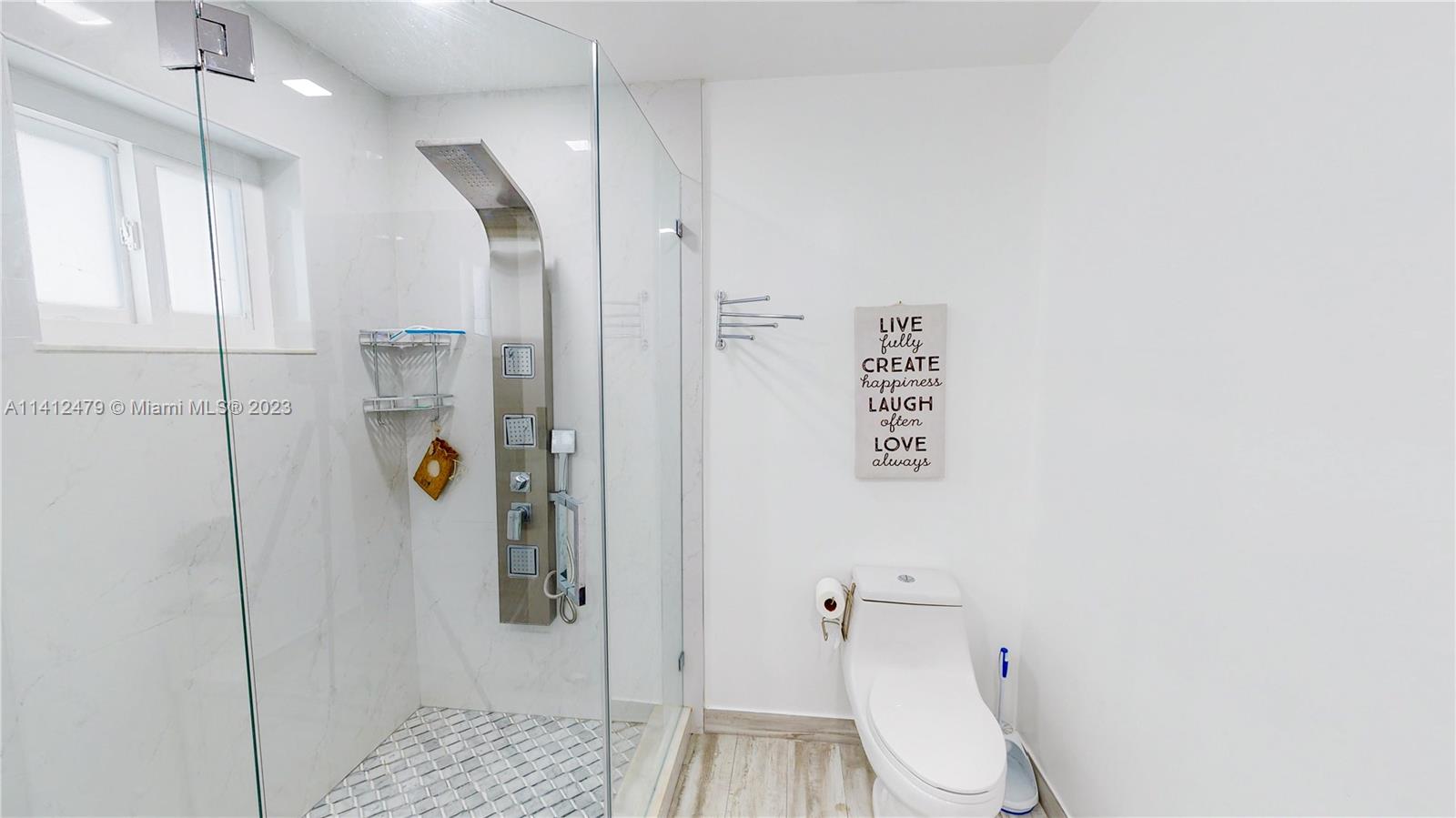13821 Southwest 14th Street Miami, FL 33184 - Photo 37 of 58 a bathroom with a shower and toilet
