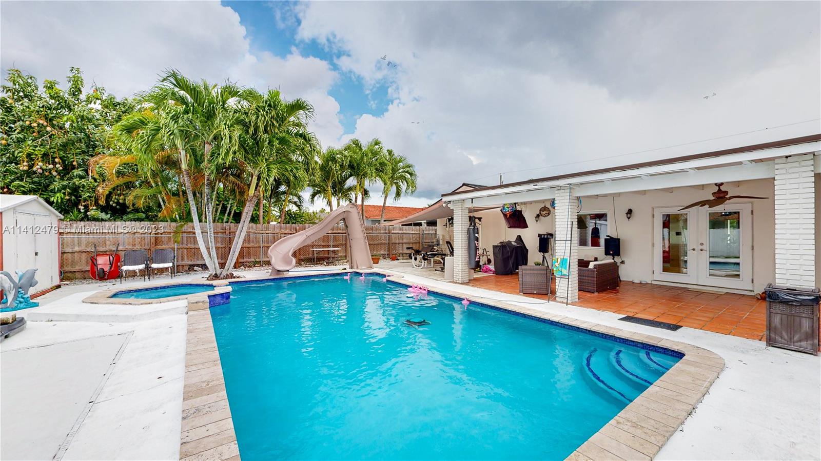 13821 Southwest 14th Street Miami, FL 33184 - Photo 42 of 58 swimming pool with outdoor seating