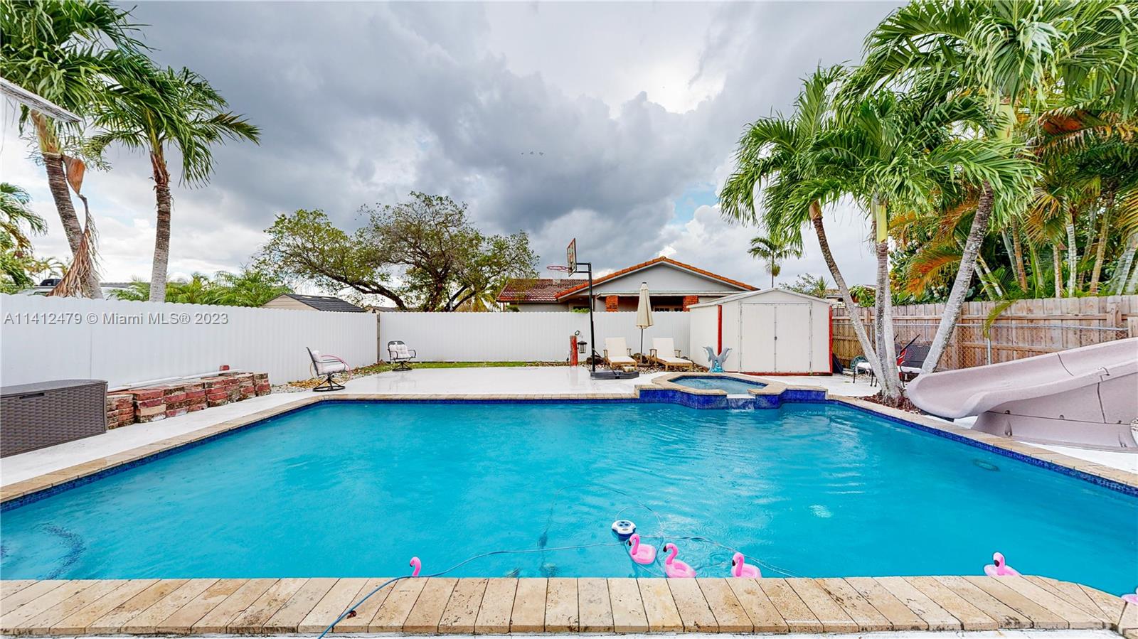13821 Southwest 14th Street Miami, FL 33184 - Photo 43 of 58 a view of a backyard with swimming pool