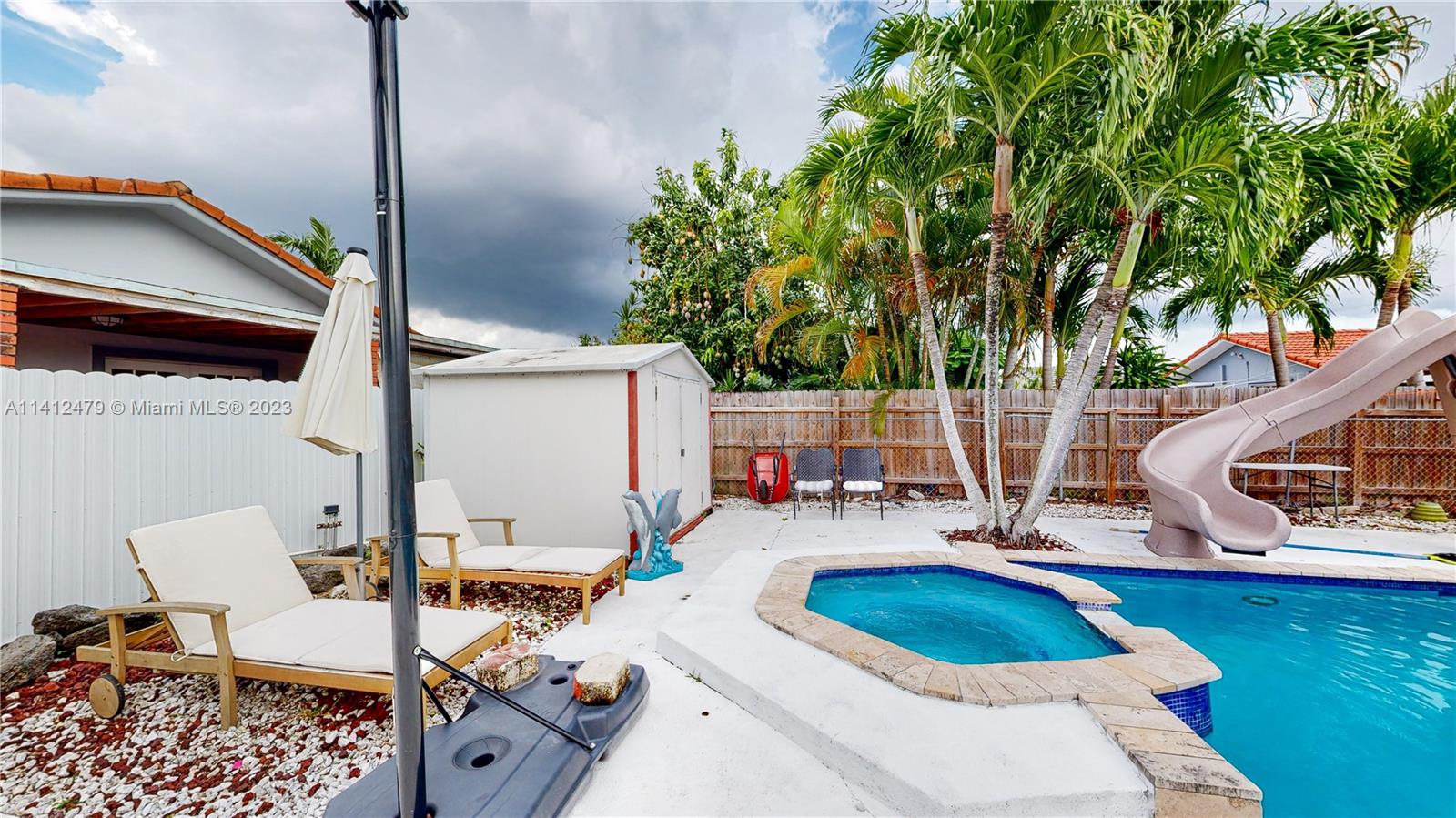 13821 Southwest 14th Street Miami, FL 33184 - Photo 46 of 58 swimming pool view with a seating space