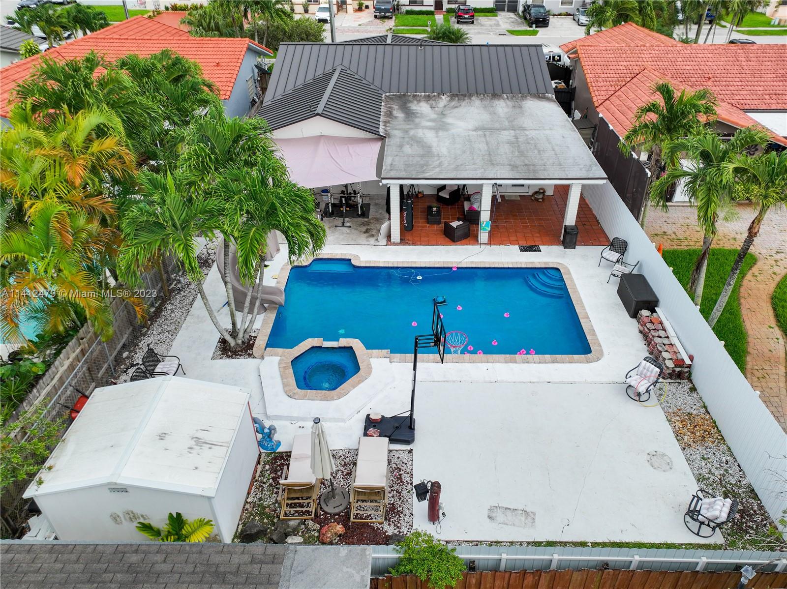 13821 Southwest 14th Street Miami, FL 33184 - Photo 48 of 58 an aerial view of house with swimming pool