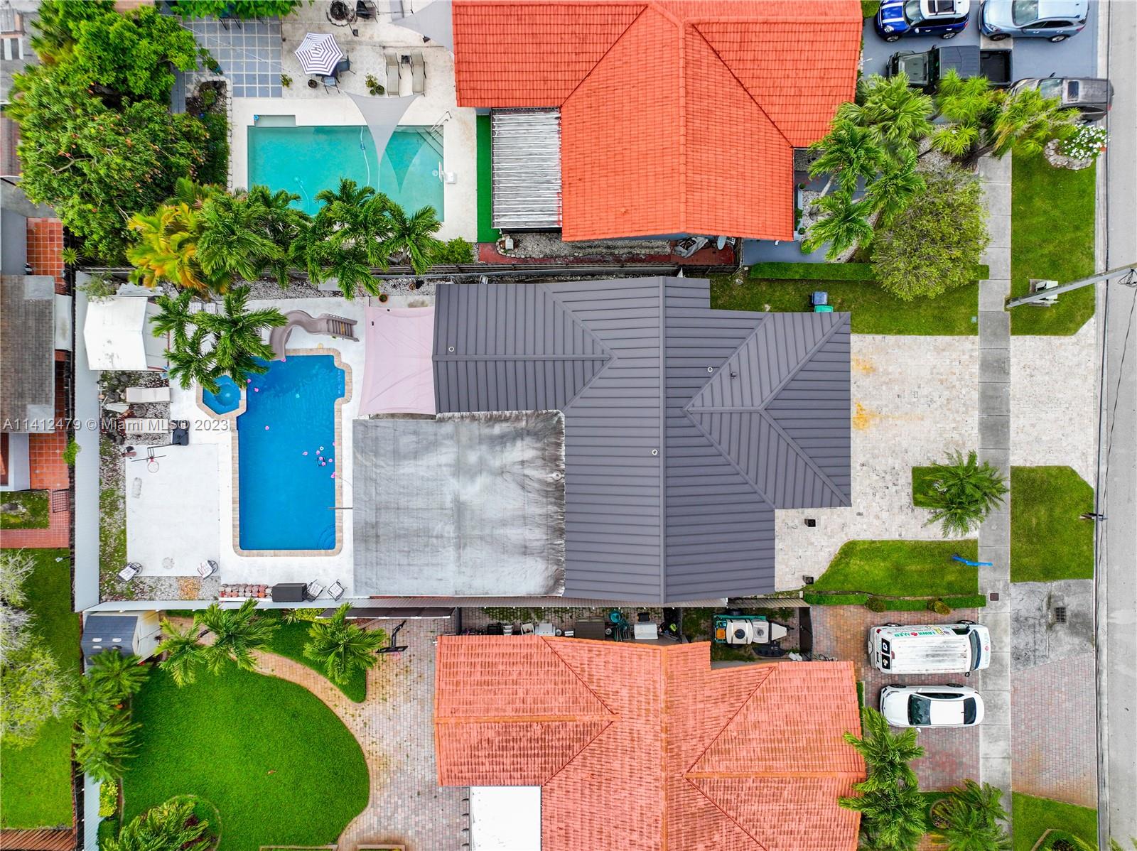 13821 Southwest 14th Street Miami, FL 33184 - Photo 50 of 58 an aerial view of a house with a yard and a large tree
