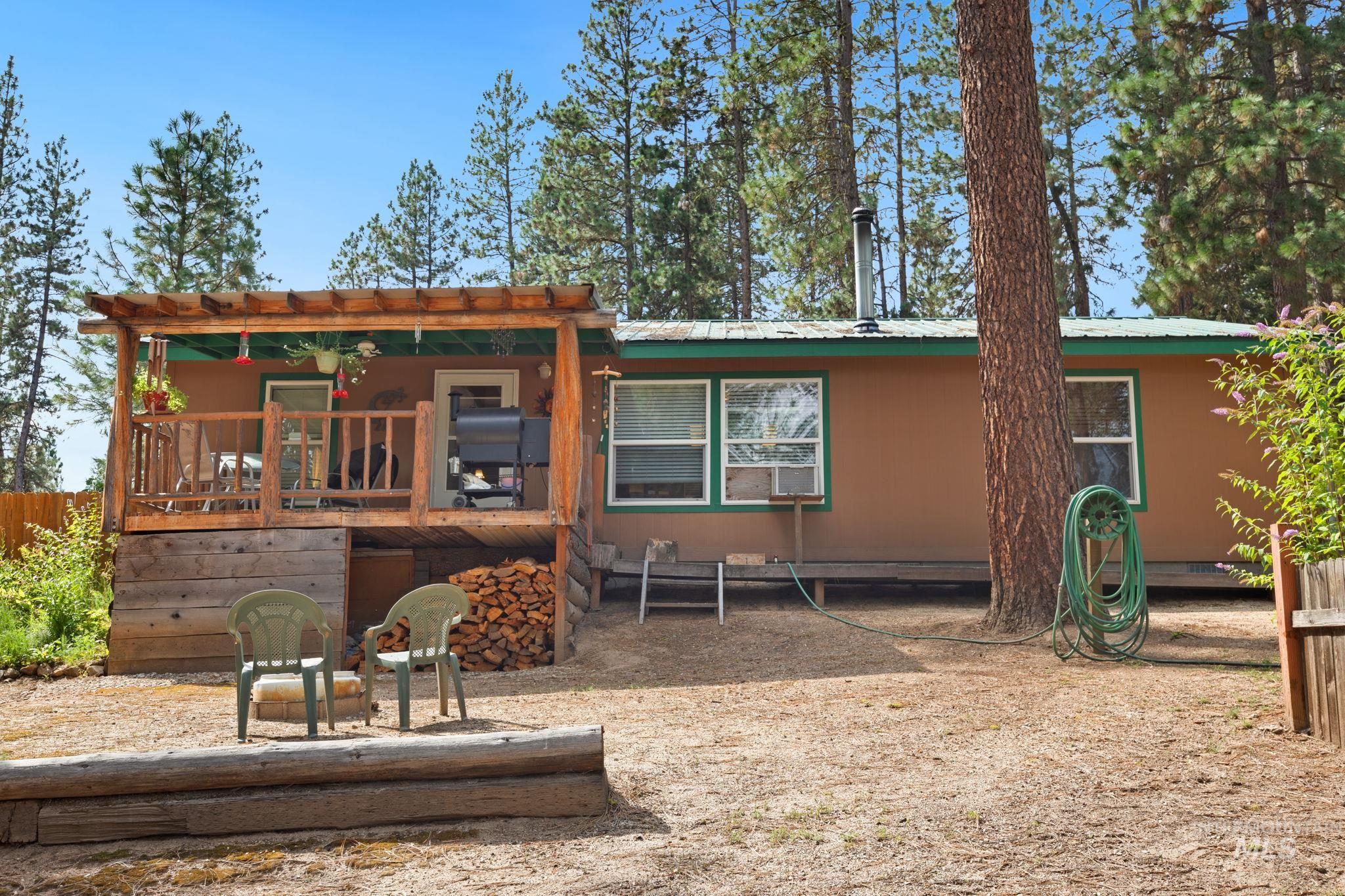 10 Cricket Road Garden Valley, ID 83622 - Photo 27 of 50 Back of house with a metal roof