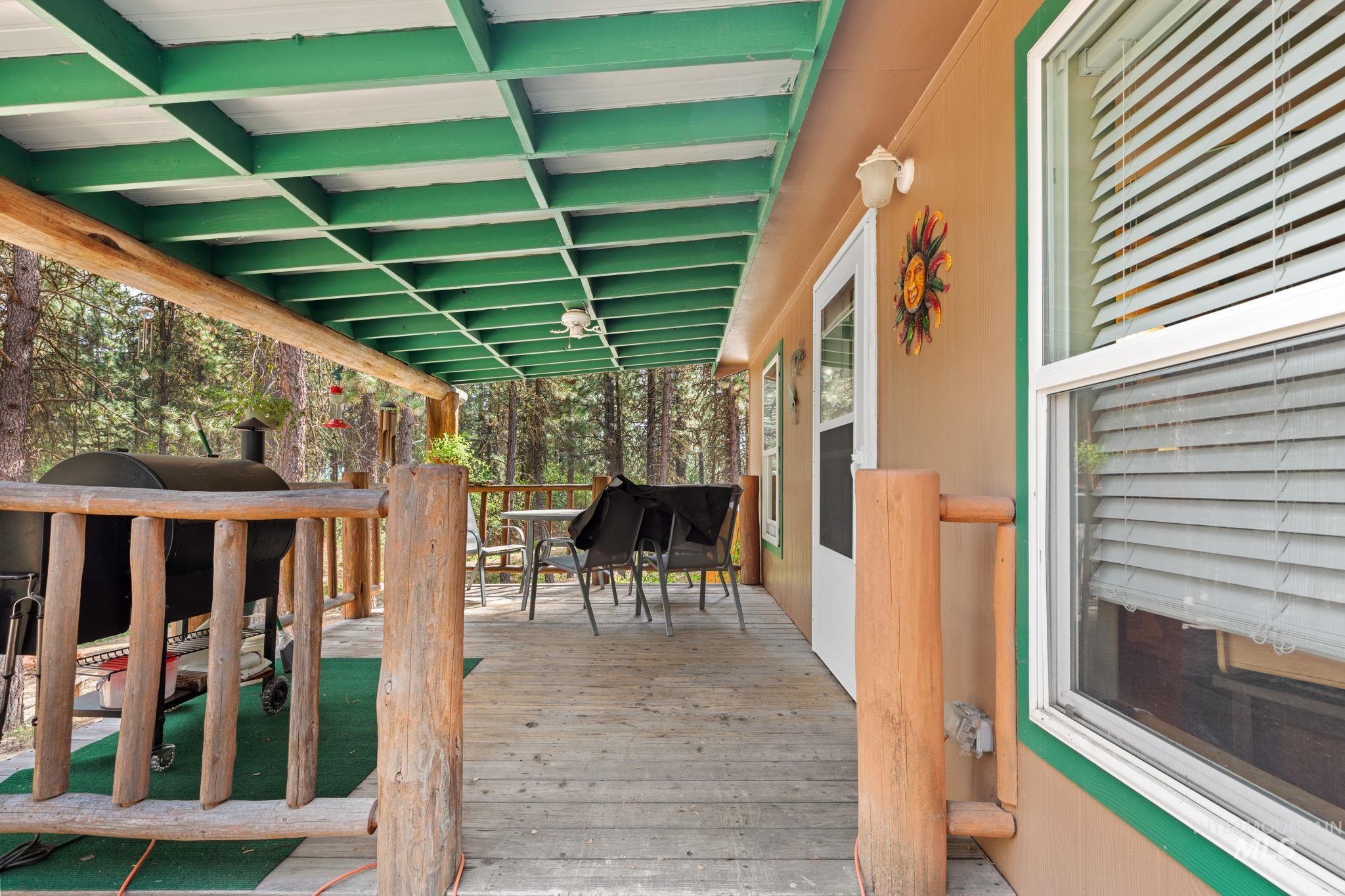 10 Cricket Road Garden Valley, ID 83622 - Photo 28 of 50 Wooden deck featuring outdoor dining space and area for grilling