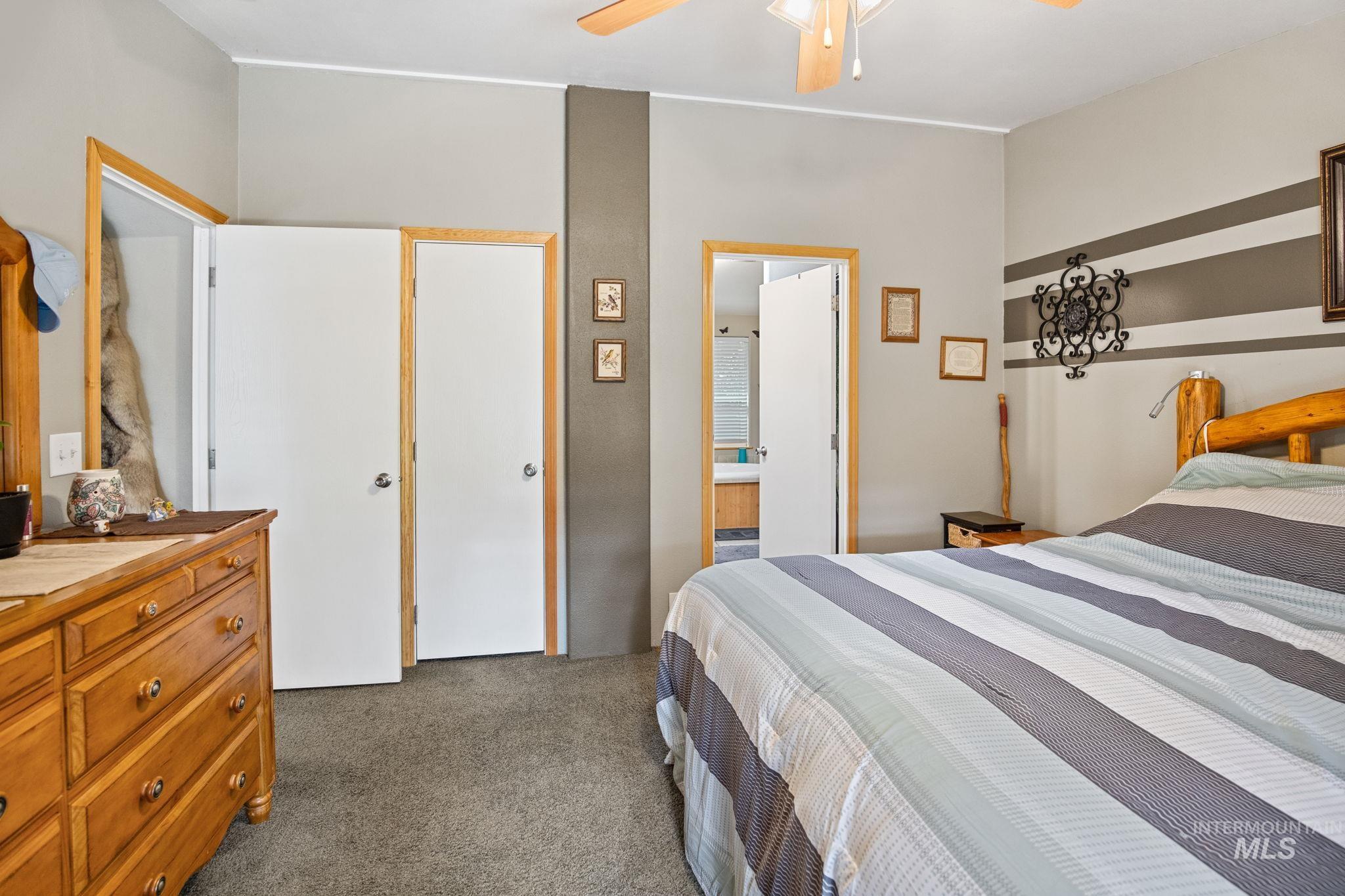 10 Cricket Road Garden Valley, ID 83622 - Photo 36 of 50 Carpeted bedroom with a ceiling fan and ensuite bath