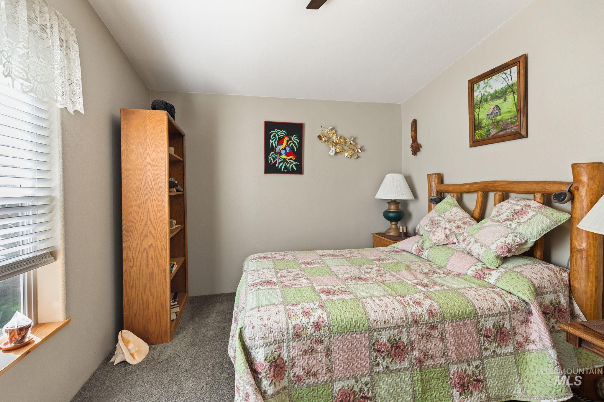 10 Cricket Road Garden Valley, ID 83622 - Photo 41 of 50 Bedroom featuring dark carpet and a ceiling fan