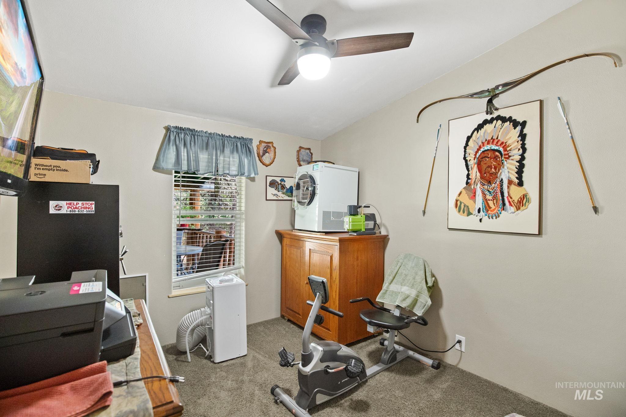 10 Cricket Road Garden Valley, ID 83622 - Photo 43 of 50 Workout room featuring carpet and a ceiling fan