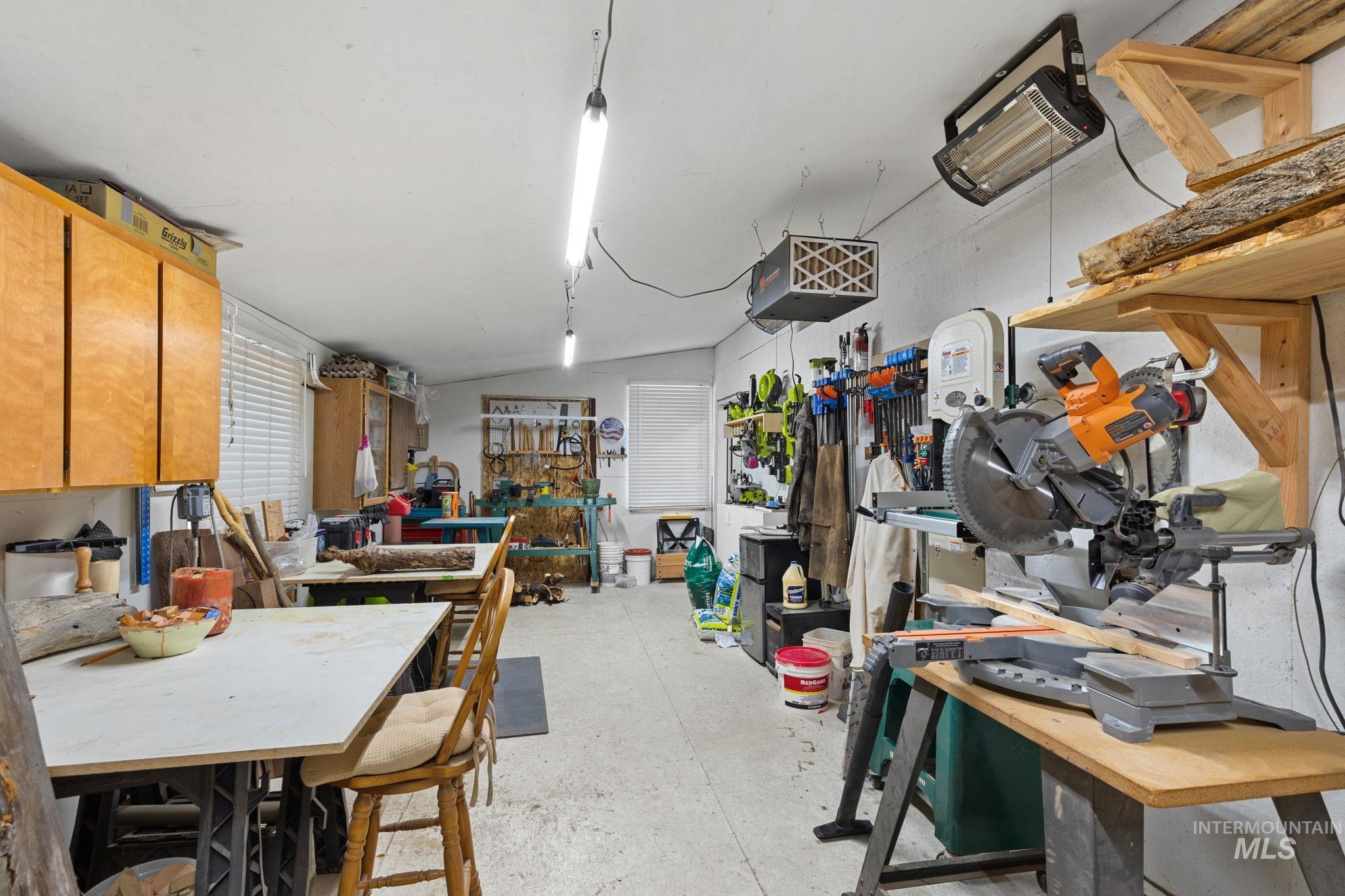 10 Cricket Road Garden Valley, ID 83622 - Photo 49 of 50 Below grade area with a workshop area and a heating unit