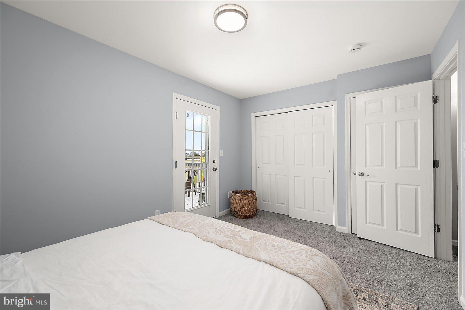 135 Jamestown Road, Unit 18A Ocean City, MD 21842 - Photo 30 of 63 a bedroom with a bed and a window