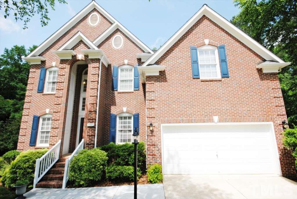 8805 Braceridge Road Raleigh, NC 27613 - Photo 2 of 25 a front view of a house with a yard