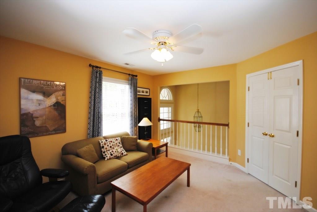 8805 Braceridge Road Raleigh, NC 27613 - Photo 14 of 25 a living room with furniture and a window