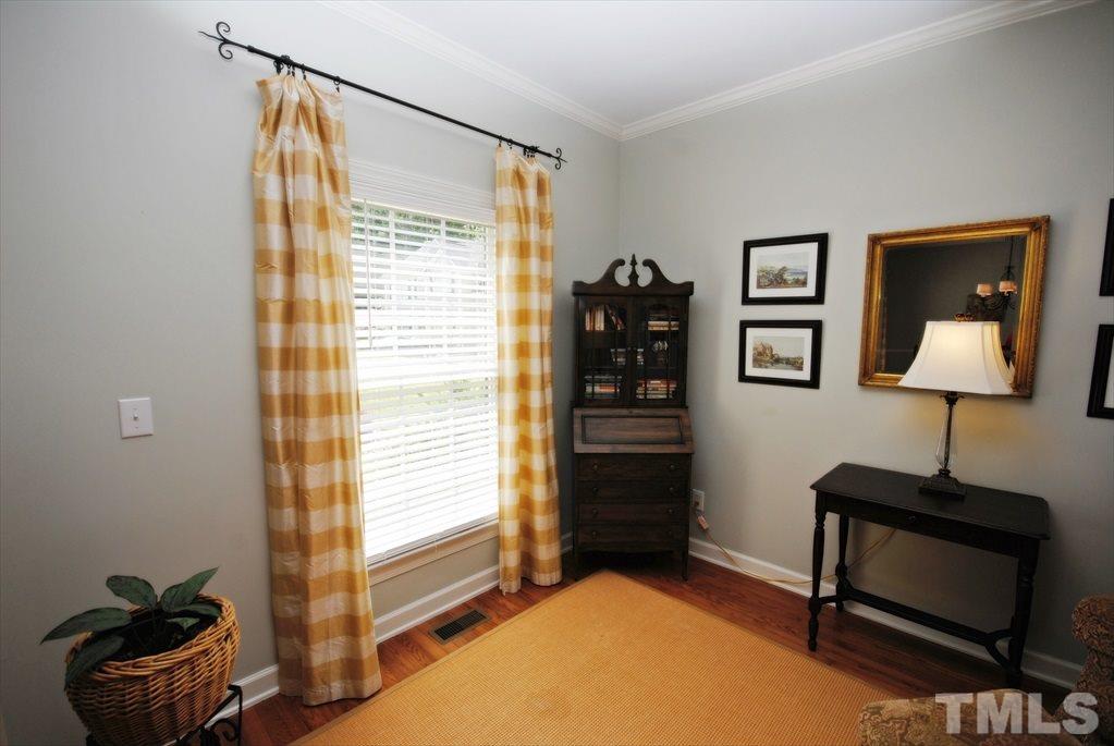 8805 Braceridge Road Raleigh, NC 27613 - Photo 4 of 25 a bedroom with a bed and a window