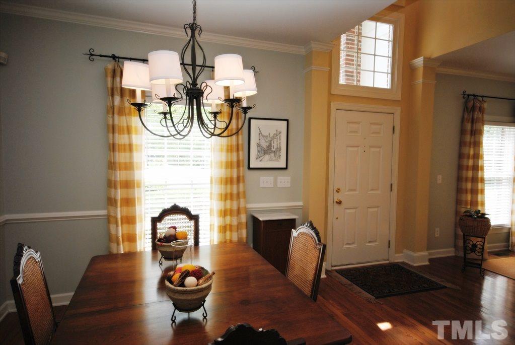 8805 Braceridge Road Raleigh, NC 27613 - Photo 5 of 25 a view of living room with dining table and windows