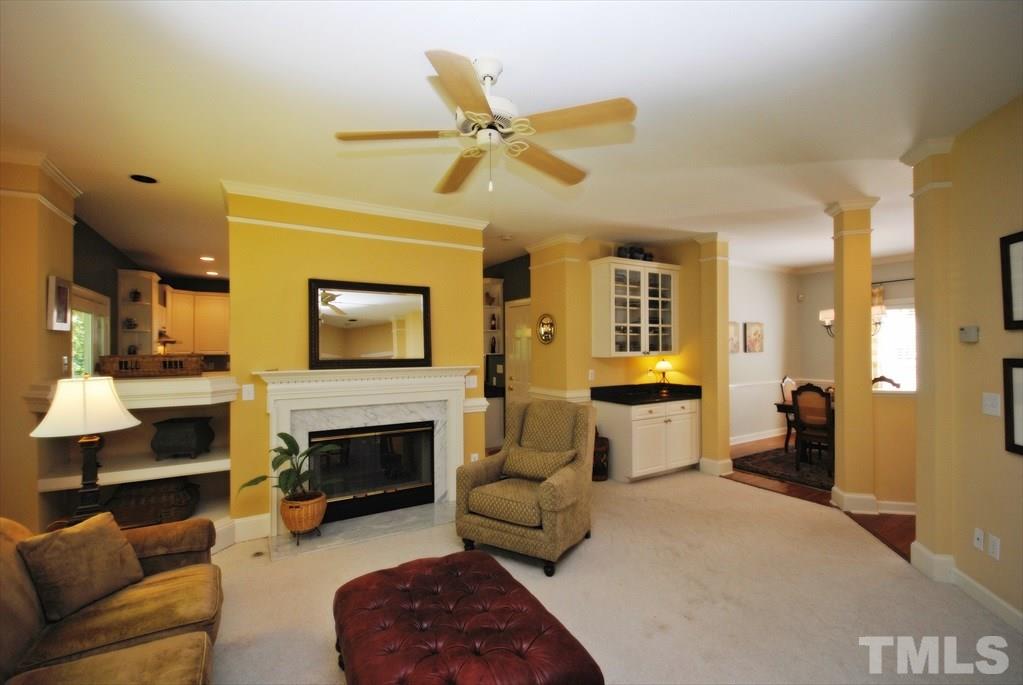 8805 Braceridge Road Raleigh, NC 27613 - Photo 6 of 25 a living room with furniture and a fireplace
