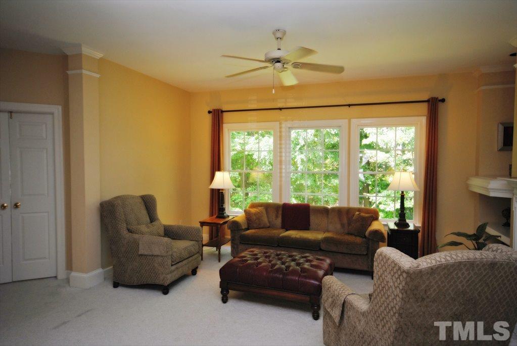 8805 Braceridge Road Raleigh, NC 27613 - Photo 7 of 25 a living room with furniture and a large window