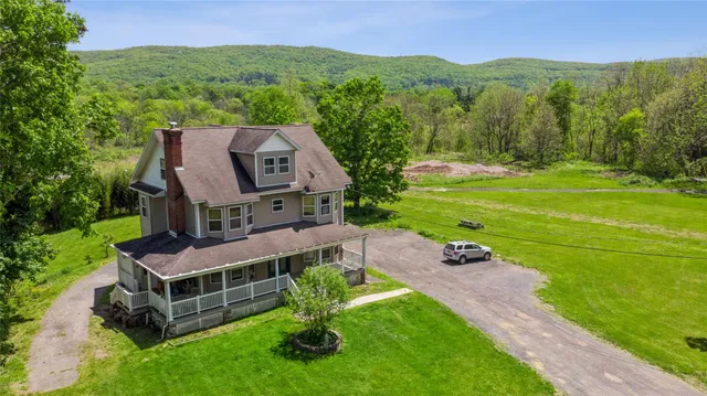 an aerial view of a house with a garden