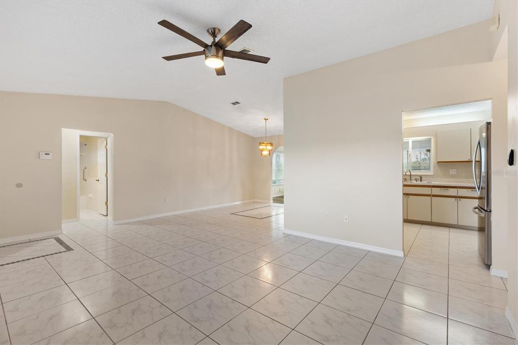 10767 Southeast 174th Loop Summerfield, FL 34491 - Photo 11 of 45 a view of a kitchen with a sink and a refrigerator