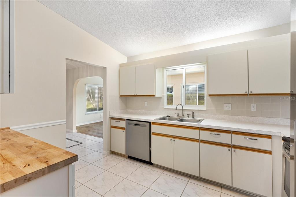 10767 Southeast 174th Loop Summerfield, FL 34491 - Photo 13 of 45 a kitchen with a sink and cabinets