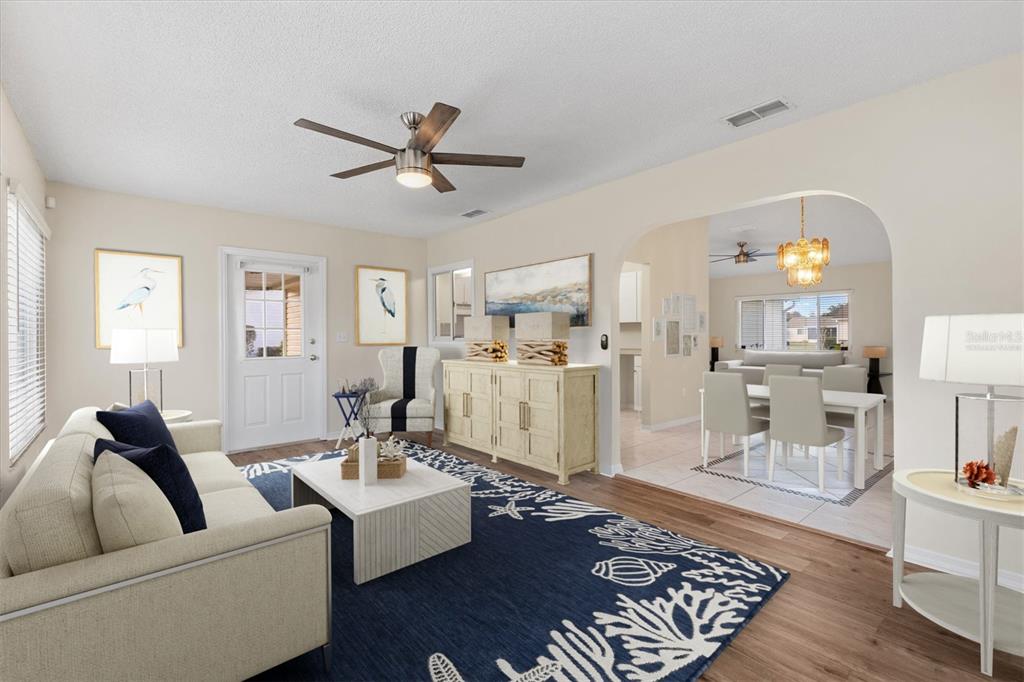 10767 Southeast 174th Loop Summerfield, FL 34491 - Photo 15 of 45 a living room with furniture and a wooden floor