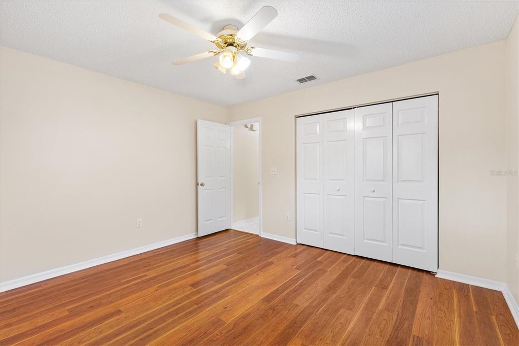 10767 Southeast 174th Loop Summerfield, FL 34491 - Photo 25 of 45 a view of an empty room with wooden floor