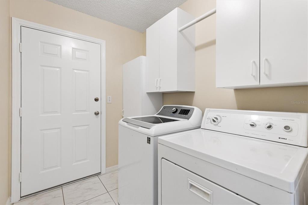 10767 Southeast 174th Loop Summerfield, FL 34491 - Photo 30 of 45 a utility room with dryer and washer