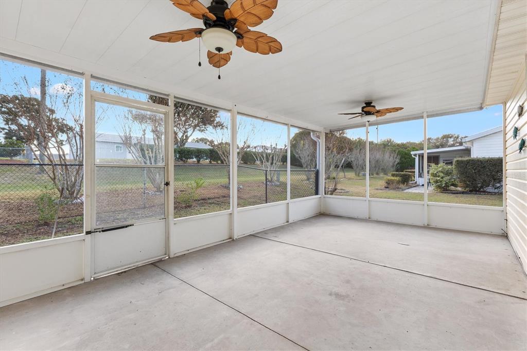 10767 Southeast 174th Loop Summerfield, FL 34491 - Photo 32 of 45 a view of an empty room with a sliding door