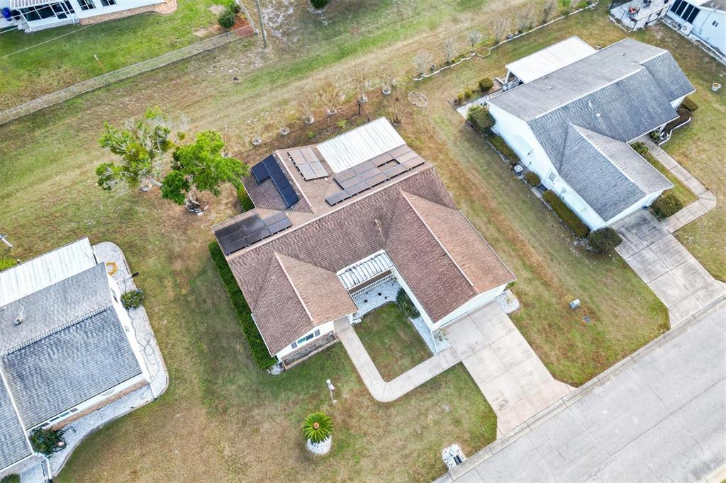 10767 Southeast 174th Loop Summerfield, FL 34491 - Photo 34 of 45 an aerial view of a house with swimming pool and garden
