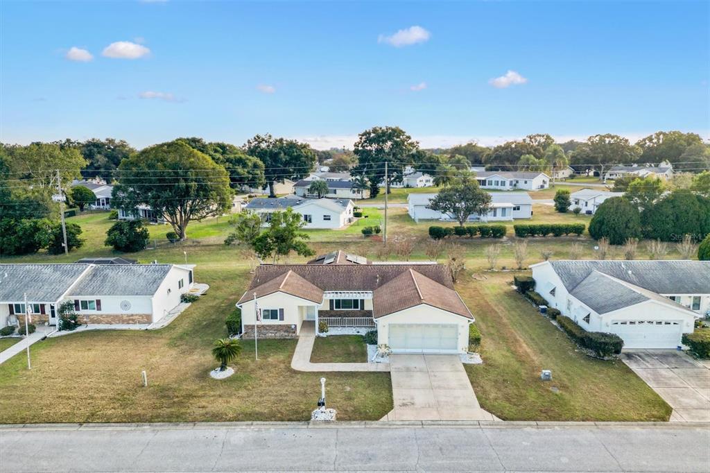 10767 Southeast 174th Loop Summerfield, FL 34491 - Photo 35 of 45 an aerial view of a house with swimming pool and lake view