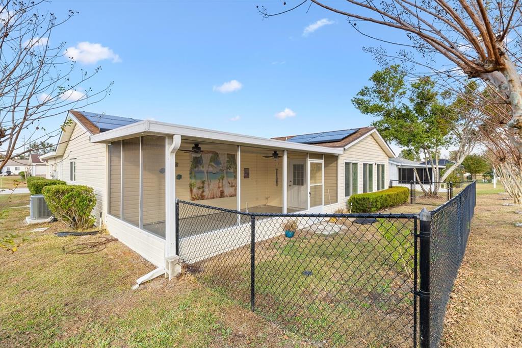 10767 Southeast 174th Loop Summerfield, FL 34491 - Photo 37 of 45 a front view of a house with a yard and garage