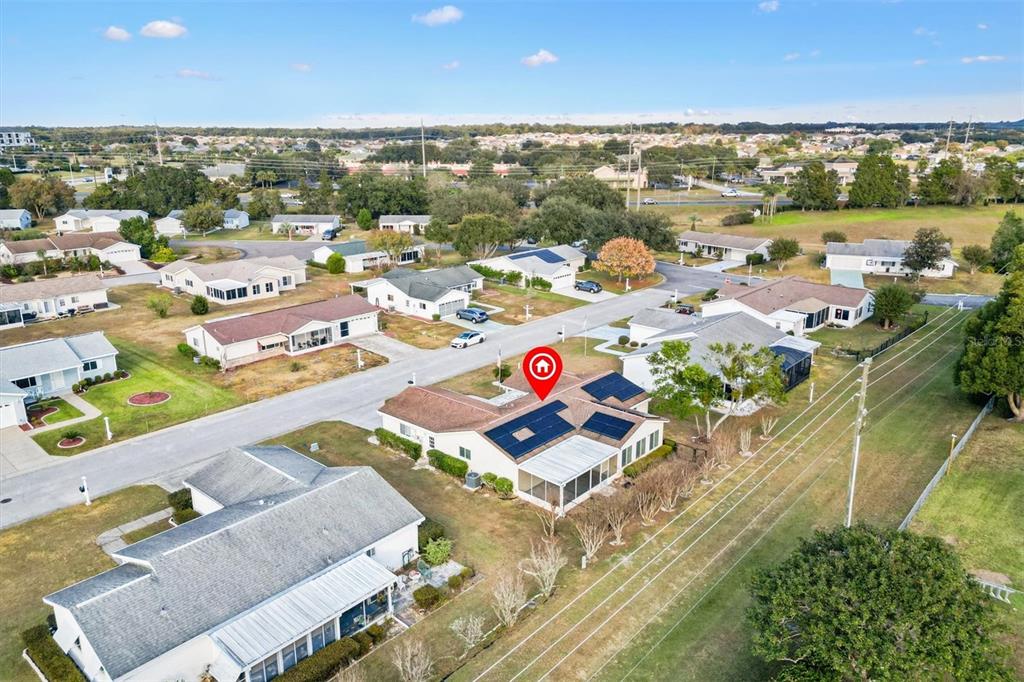10767 Southeast 174th Loop Summerfield, FL 34491 - Photo 42 of 45 an aerial view of residential houses with outdoor space