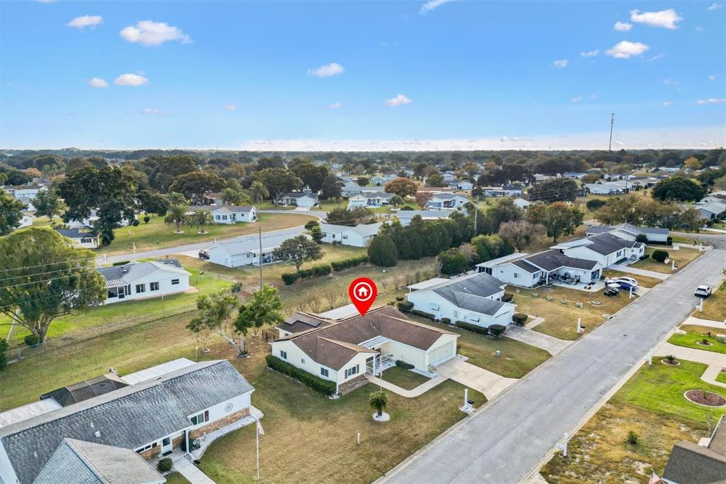 10767 Southeast 174th Loop Summerfield, FL 34491 - Photo 44 of 45 an aerial view of a house with swimming pool and ocean view