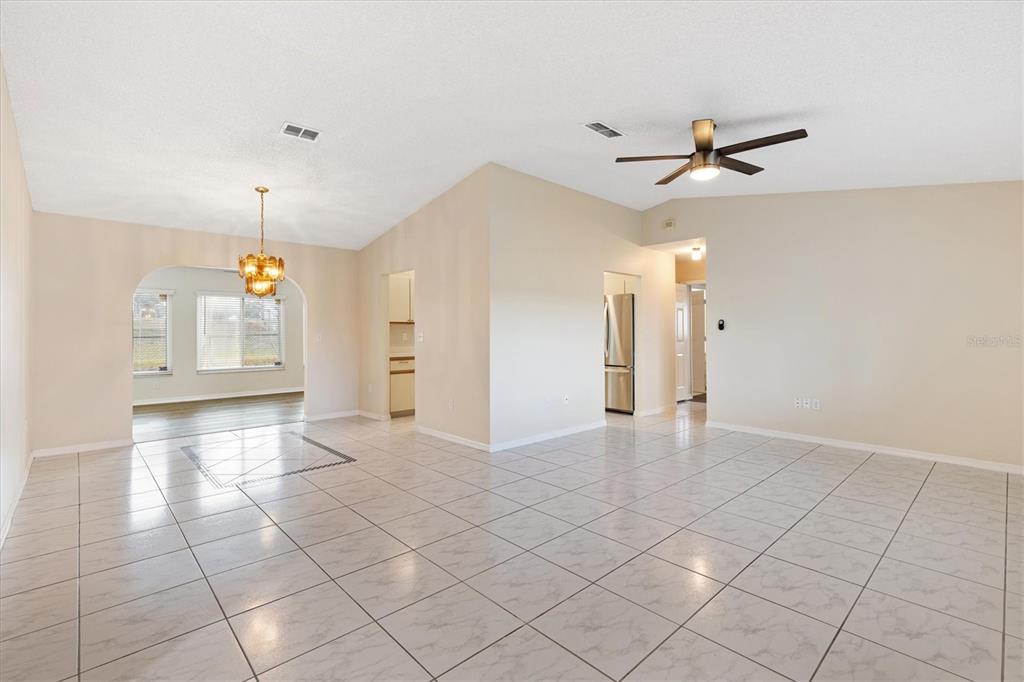 10767 Southeast 174th Loop Summerfield, FL 34491 - Photo 7 of 45 a view of a livingroom with a ceiling fan and window