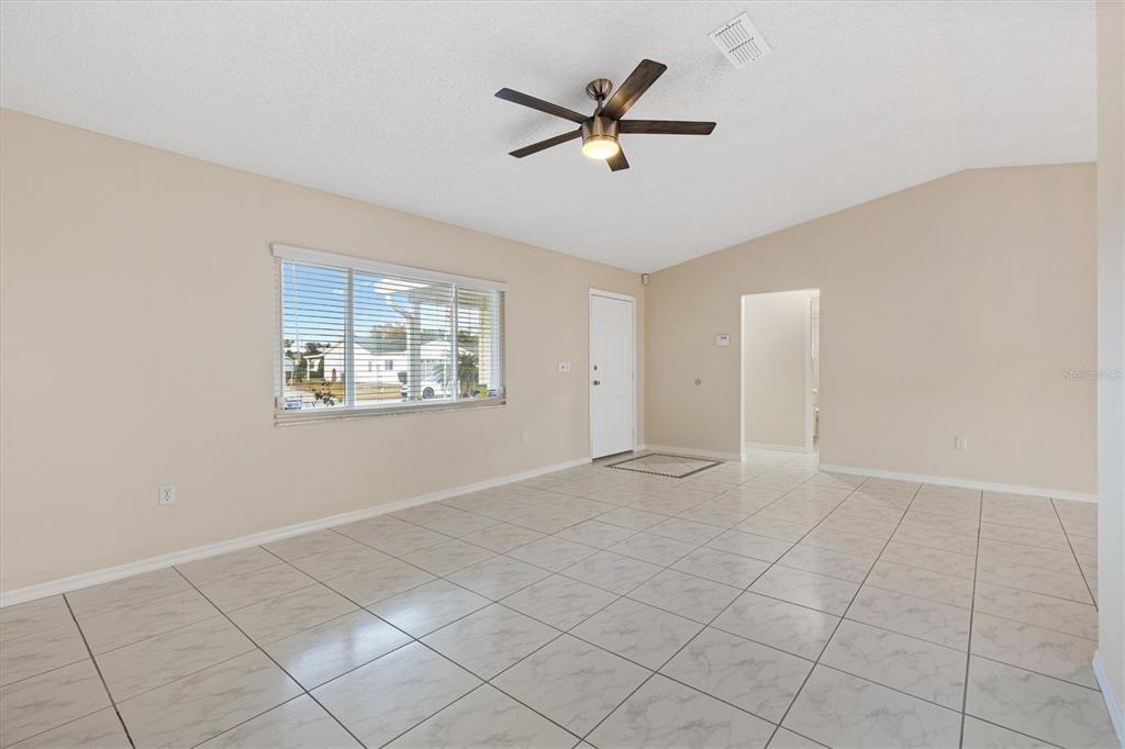 10767 Southeast 174th Loop Summerfield, FL 34491 - Photo 8 of 45 a view of an empty room with a window