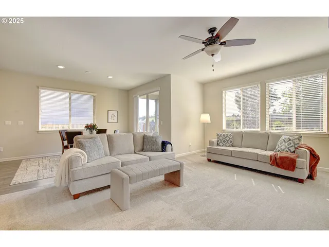 a bedroom with a bed a chandelier and a window