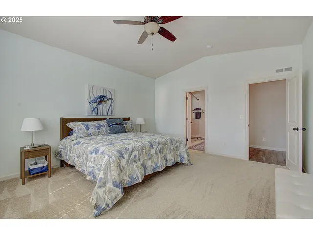 a bathroom with a granite countertop sink mirror and shower