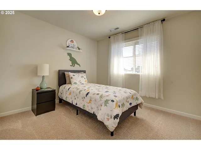 a bathroom with a granite countertop sink a toilet and a mirror