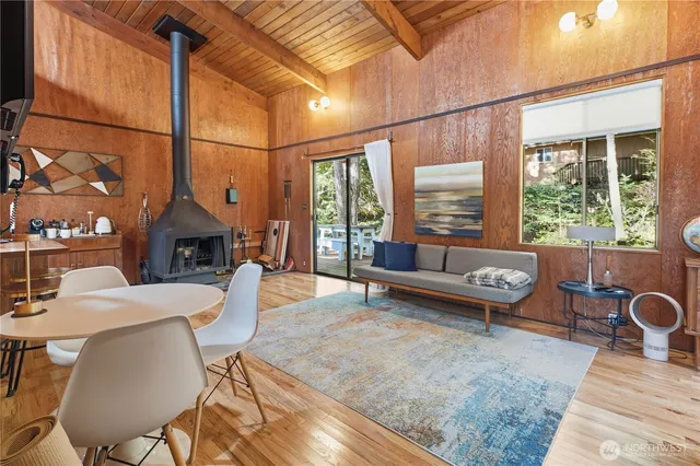 a living room with furniture a fireplace and a table