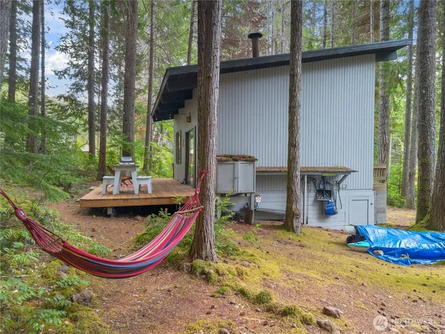 a view of a small deck with a table and chairs