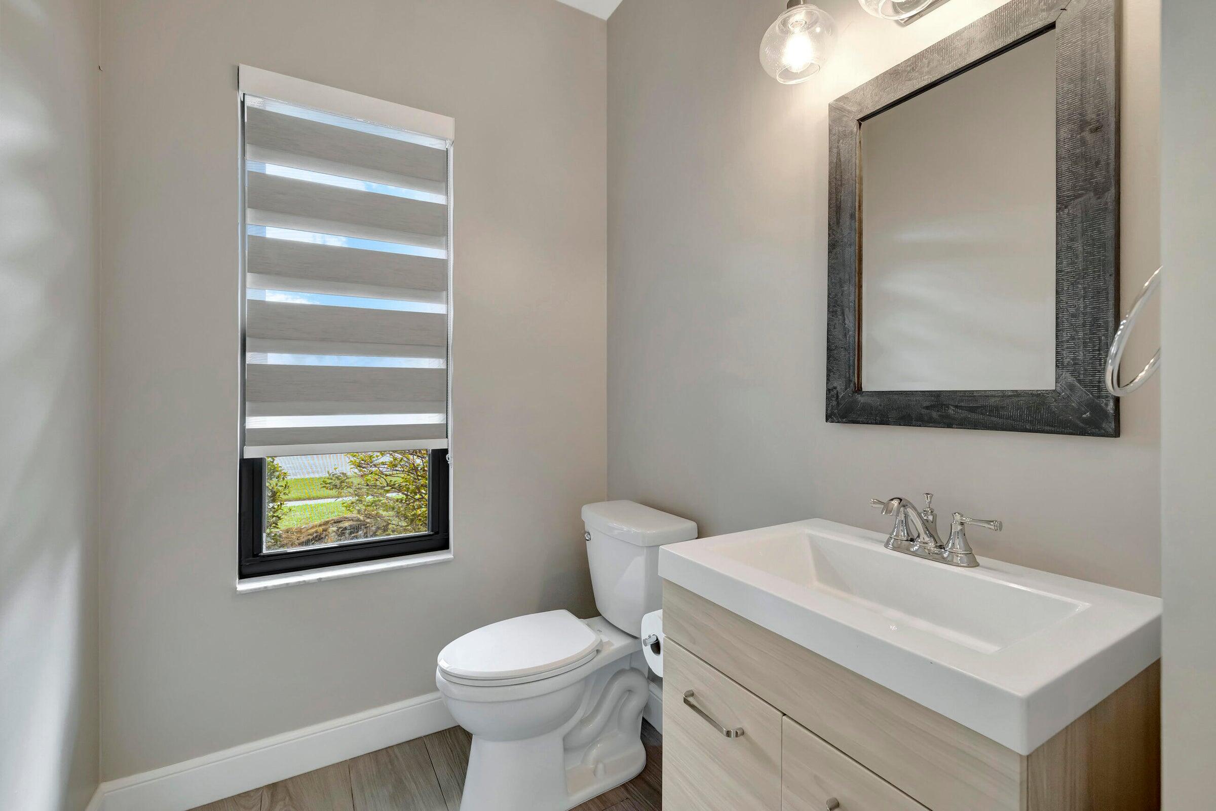 4875 Hunters Way Boca Raton, FL 33434 - Photo 31 of 43 Half Bath @ entry
