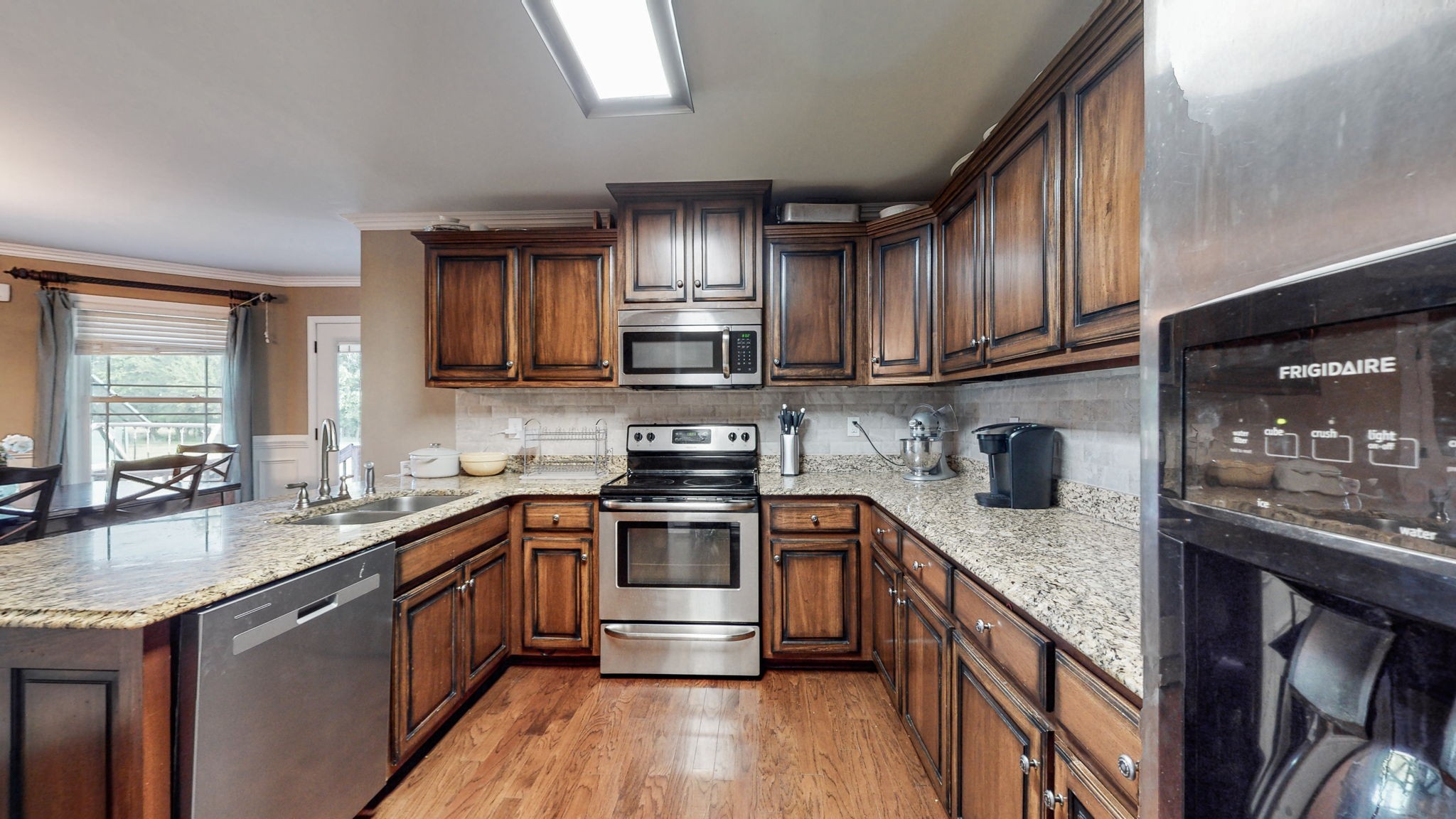 2870 Canoe Branch Road Lebanon, TN 37087 - Photo 19 of 45 a kitchen with stainless steel appliances granite countertop a sink stove and cabinets