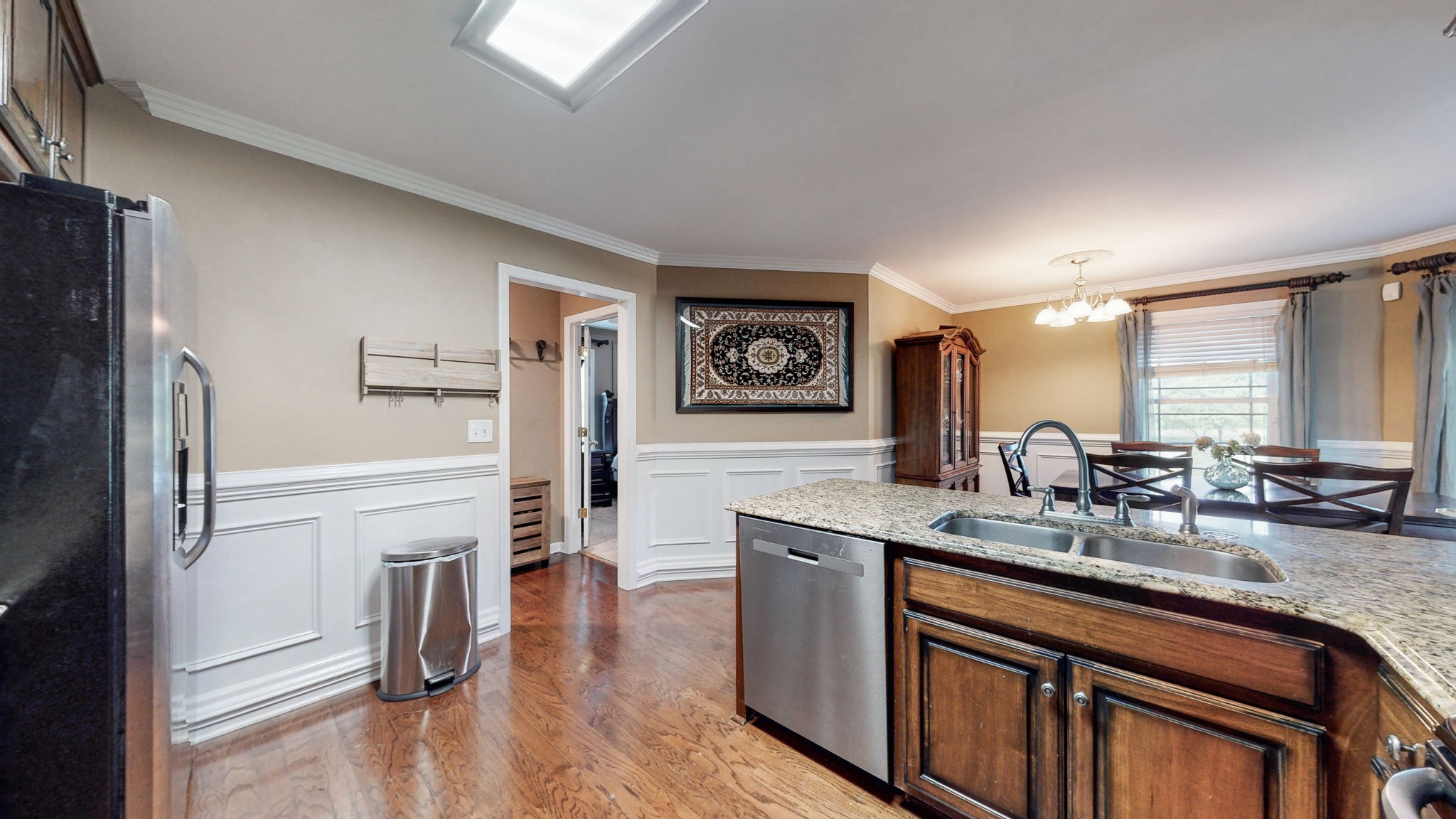 2870 Canoe Branch Road Lebanon, TN 37087 - Photo 20 of 45 a kitchen with stainless steel appliances granite countertop a refrigerator a sink dishwasher a stove and white countertops with wooden floor