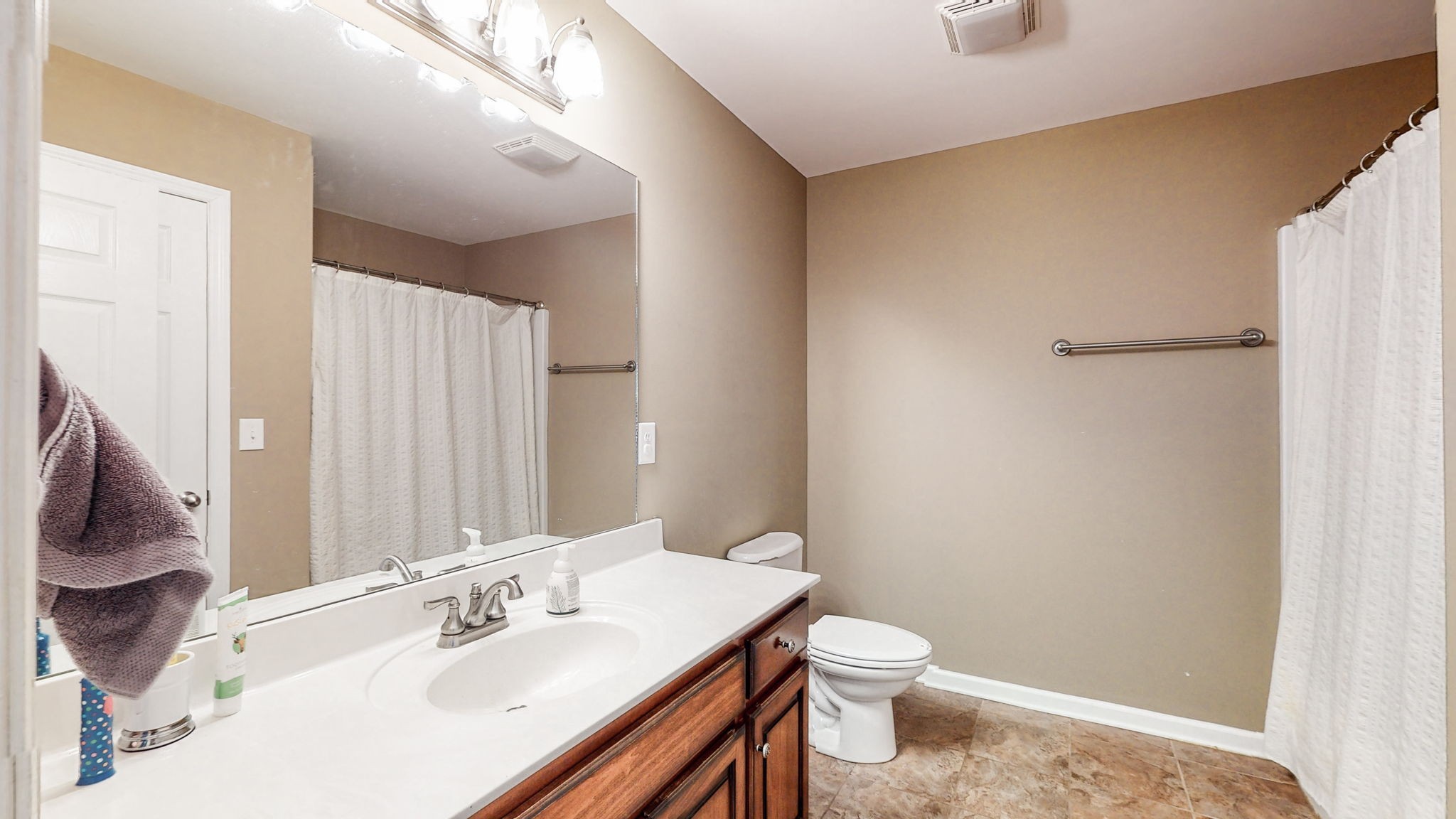 2870 Canoe Branch Road Lebanon, TN 37087 - Photo 30 of 45 a bathroom with a sink a toilet and shower curtain
