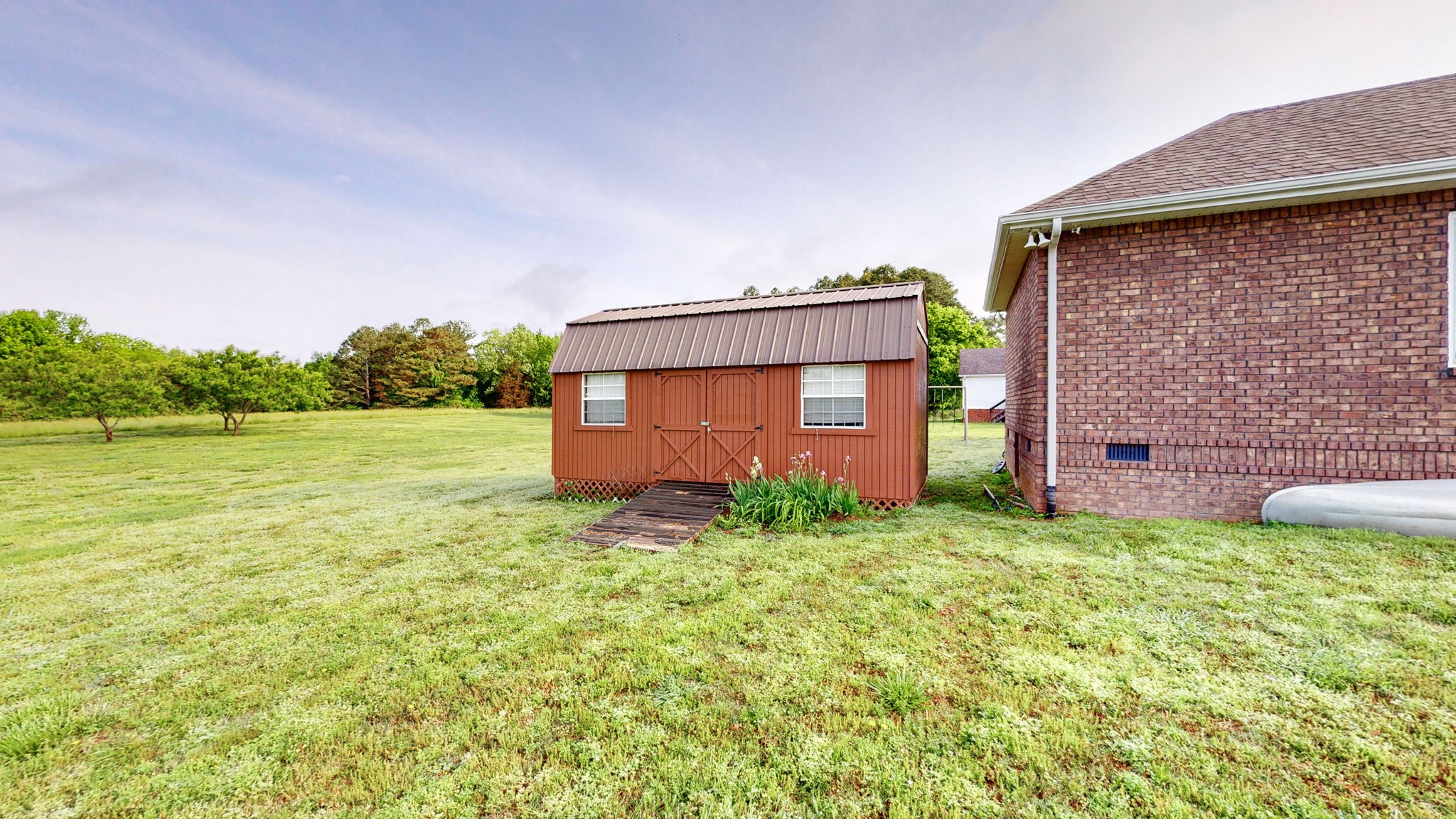 2870 Canoe Branch Road Lebanon, TN 37087 - Photo 38 of 45 a backyard of a house with lots of green space and plants
