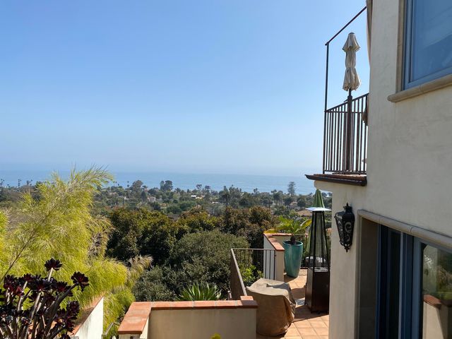 a view of balcony with furniture