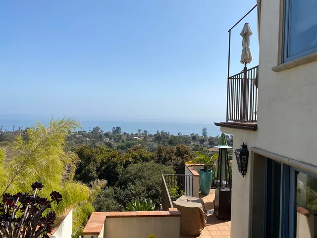 a view of balcony with furniture