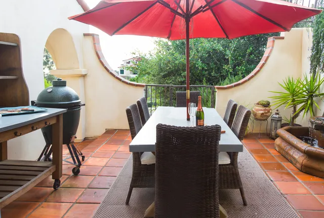 swimming pool view with a seating space