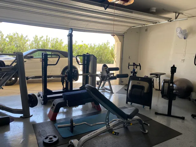 a view of a workspace with furniture and floor to ceiling window