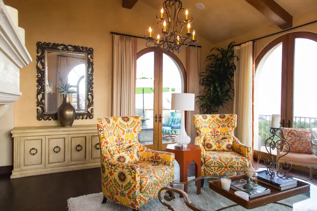 a living room with furniture and a large mirror